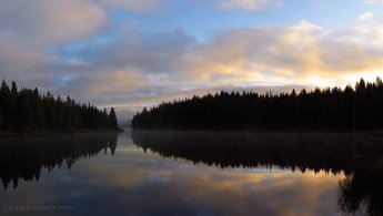 Sunrise in the forest reflected on a calm lake desktop wallpapers