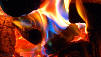 Blue fire emerging from the embers desktop wallpapers